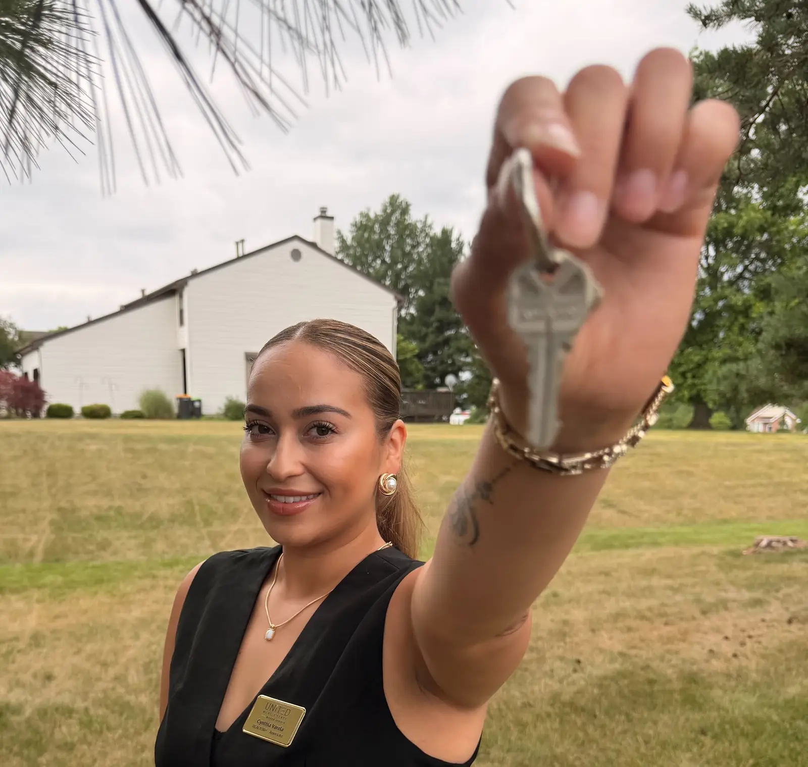 Cynthia Varela holding up a house key