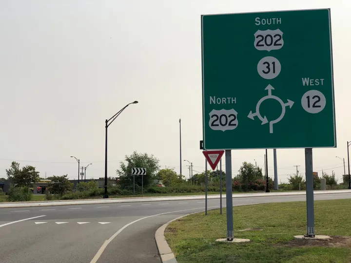Roundabout sign for US 202, Route 31 and Route 12 at the Flemington Circle